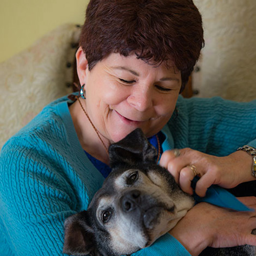 Maribeth Decker medical intuitive holding her dog