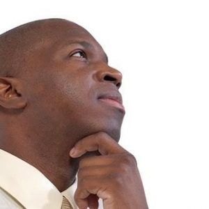 close up black man executive pondering